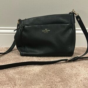 Black Genuine Leather Kade Spade Crossbody bag with zippered outer pocket.